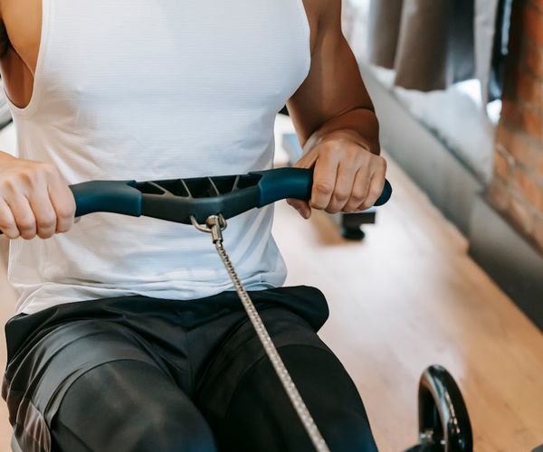 Close up of a man focusing on intense physical exercise in studio.